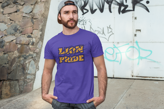 Man wearing a purple 'Lion Pride' t-shirt in front of a graffiti-covered wall.